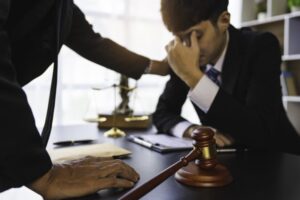 Escondido criminal defense attorney reassuring a client during a confidential legal consultation