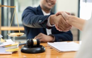 Coronado criminal defense attorney shaking hands with a client during an initial legal consultation