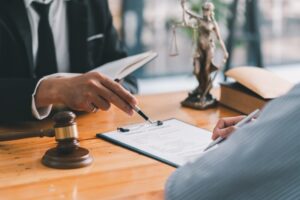 Attorney explaining a subpoena and legal process to a client during a consultation with a Del Mar criminal defense attorney.