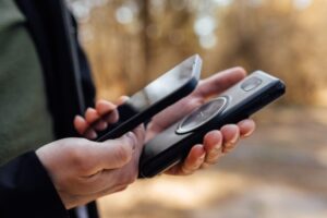 Person checking a mobile phone, illustrating digital privacy and search laws explained by a La Jolla criminal defense attorney.