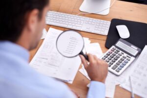 EIDL loan audit documents and financial records under investigation explained by a Chula Vista criminal defense lawyer.