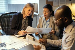 Financial documents labeled for EIDL loan audit under review during a fraud investigation with guidance from an El Cajon criminal defense attorney.