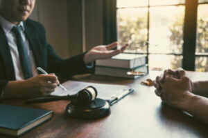 Carlsbad criminal defense attorney explaining post-conviction relief options to a client during a confidential legal consultation.