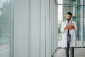 Healthcare professional in a clinical setting representing medical compliance and legal matters handled by a San Diego Health Care Fraud Defense Attorney.
