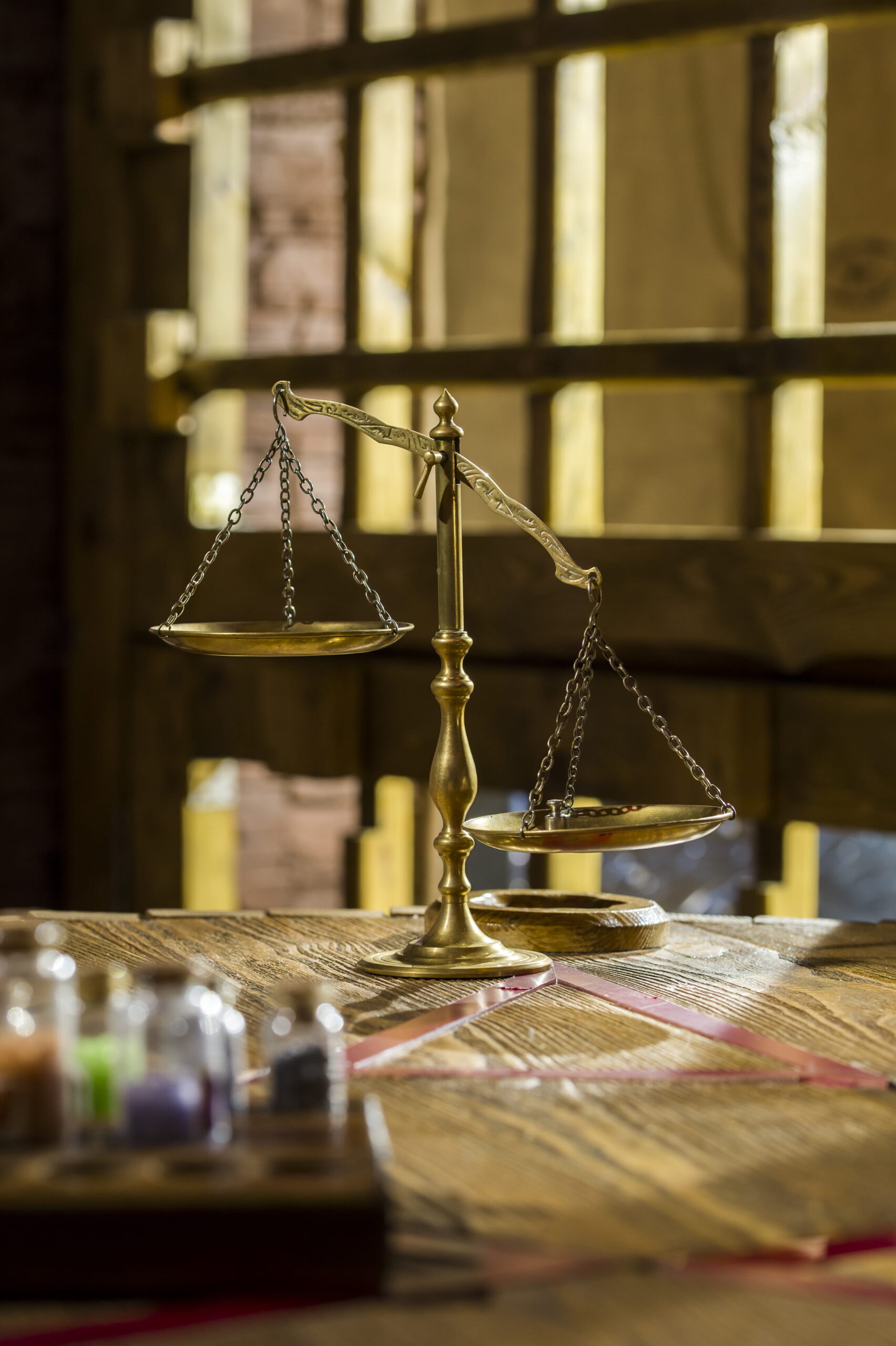 Lawyer's office with justice scales representing drug crime defense in San Diego